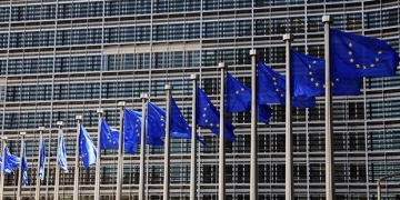 epa06040850 (FILE) - A file photograph dated on 14 June 2012 (re-issued on 21 June 2017) shows European Union flags waving outside the EU Commission headquarters in Brussels, Belgium. The Jury of the 2017 Princess of Asturias Award for Concord, announced the European Union (EU) as the winner of the 2017 Princess of Asturias Award for Concord during a ceremony held in Oviedo, province of Asturias, northern Spain, on 21 June 2017.  EPA/OLIVIER HOSLET