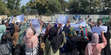 epa09444881 Afghan women hold placards as they demand Taliban to protect their rights in Kabul, .  EPA-EFE/STRINGER