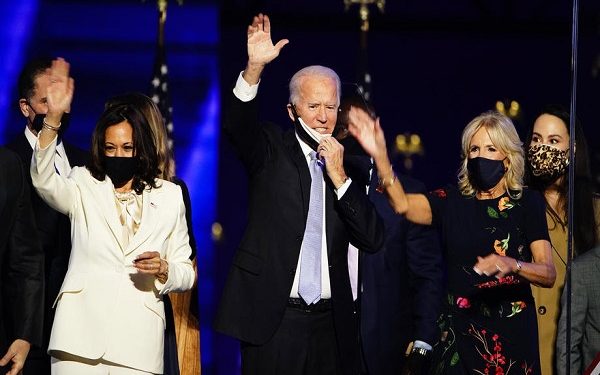epa08806608 President-elect Joe Biden (C) and Dr. Jill Biden (R) with Vice President-elect Kamala Harris (L) are joined by family members after Biden delivered his victory address after being declared the winner in the 2020 presidential election in Wilmington, Delaware, USA, 07 November 2020. Biden defeated incumbent US President Donald J. Trump.  EPA-EFE/JIM LO SCALZO