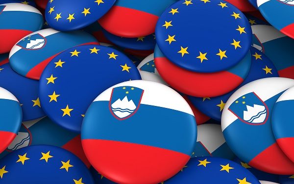 Slovenia and EU Badges Background - Pile of Slovenian and European Flag Buttons 3D Illustration