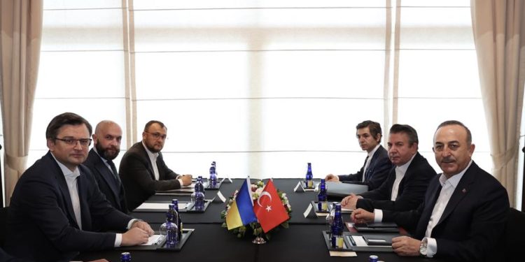 epa09814151 A handout photo made available by the Turkish Foreign Ministry Press Office shows Turkish Foreign Minister Mevlut Cavusoglu (R) and his Ukrainian counterpart Dmytro Kuleba (L) and their delegations before their meeting with the Russian Foreign Minister  during the Antalya Diplomacy Forum in Antalya, Turkey, 10 March 2022. Ukrainian Foreign Minister Dmytro Kuleba will meet with Russian Foreign Minister Sergei Lavrov for diplomatic talks on the Russian invasion of Ukraine.  EPA-EFE/TURKISH FOREIGN MINISTRY HANDOUT  HANDOUT EDITORIAL USE ONLY/NO SALES