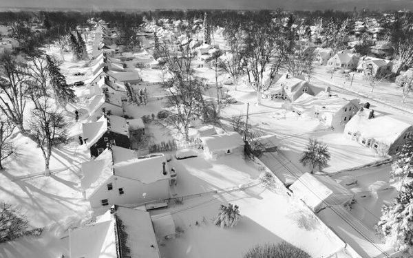 A drone image captures a neighborhood, in Cheektowaga, N.Y., More snow is expected in Western New York on Monday. (John Waller/AP)