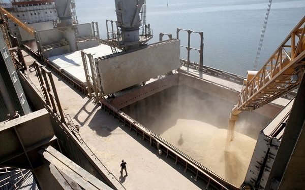 A dockyard worker watches as barley grain is mechanically poured into a 40,000 ton ship at a Ukrainian agricultural exporter's shipment terminal in the southern Ukrainian city of Nikolaev July 9, 2013. REUTERS/Vincent Mundy