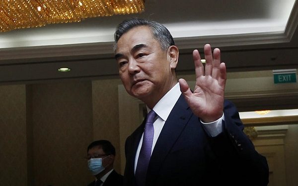 epa08737065 Chinese Foreign Minister Wang Yi (R), arrives at the Peace Palace in Phnom Penh, Cambodia, 12 October 2020. Wang Yi is on an official visit to Cambodia, during which he will witness a signing ceremony on documents regarding cooperation with Cambodian Prime Minister Hun Sen.  EPA-EFE/MAK REMISSA