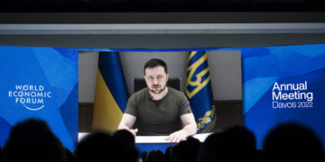 epa09968633 Ukrainian President Volodymyr Zelensky delivers an address via videolink during the opening plenary session of the 51st annual meeting of the World Economic Forum (WEF) in Davos, Switzerland, 23 May 2022. The forum has been postponed due to the COVID-19 pandemic and was rescheduled to early summer. The meeting brings together entrepreneurs, scientists, corporate and political leaders in Davos under the topic 'History at a Turning Point: Government Policies and Business Strategies' from 22 to 26 May 2022.  EPA-EFE/GIAN EHRENZELLER