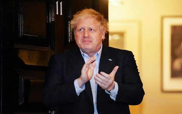 epa08344738 (FILE) A handout photo made available by No. 10 Downing Street of Britain's Prime Minister Boris Johnson applauding during a 'Claps for our Carers' outside 11 Downing Street in London, Britain, 02 April March 2020 (re-issued 05 April 2020). According to reports on 05 April 2020, British Prime Minister Boris Johnson was admitted to hospital ten days after being tested positive for coronavirus Covid-19.  EPA-EFE/PIPPA FOWLES / DOWNING STREET  HANDOUT EDITORIAL USE ONLY/NO SALES