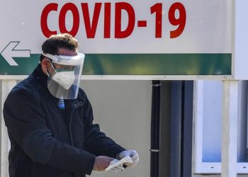 epa08829045 Man wearing protective mask,walks in front of a COVID-19 center at the University Clinic for Infectious Diseases in Skopje, Republic of North Macedonia, 19 November 2020. Due to the high number of COVID-19 cases the authorities in the country are considering new measures to restrain the disease. North Macedonia is one of the worst in Europe in deaths per capita, having 1397 people who died, with population of two millions, until 18 November 2020 with the symptoms of COVID-19 since the start of the pandemic.  EPA-EFE/GEORGI LICOVSKI