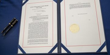 epa08936257 The article of impeachment passed by the House is ready for Speaker of the House Nancy Pelosi's signature in the US Capitol in Washington, DC, USA, 13 January 2021. US President Donald J. Trump was impeached for incitement of insurrection following the attack on the Capitol on 06 January as lawmakers worked to certify Joe Biden as the next President of the United States.  This is the second time the US House of Representatives impeach Trump, making him the first President to be impeached twice.  EPA-EFE/SHAWN THEW