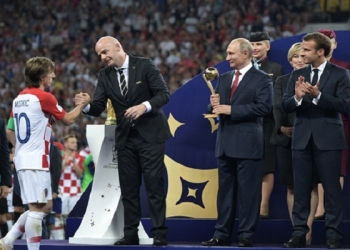 epa06891968 FIFA President Gianni Infantino (2-L) shakes hands with Croatian player Luka Modric (L), as Russian President Vladimir Putin (2-R) and French President Emmanuel Macron (R) look on during the award ceremony after the FIFA World Cup 2018 final between France and Croatia in Moscow, Russia, 15 July 2018.

(RESTRICTIONS APPLY: Editorial Use Only, not used in association with any commercial entity - Images must not be used in any form of alert service or push service of any kind including via mobile alert services, downloads to mobile devices or MMS messaging - Images must appear as still images and must not emulate match action video footage - No alteration is made to, and no text or image is superimposed over, any published image which: (a) intentionally obscures or removes a sponsor identification image; or (b) adds or overlays the commercial identification of any third party which is not officially associated with the FIFA World Cup)  EPA-EFE/ALEXEI NIKOLSKY / SPUTNIK  / KREMLIN POOL / POOL MANDATORY CREDIT