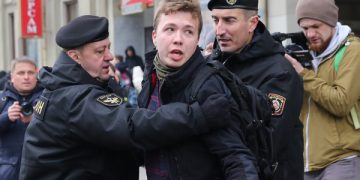 epa09223072 (FILE) Police officers detain a journalist Roman Protasevich attempting to cover a rally in Minsk, Belarus, 26 March 2017 (reissued 23 May 2021). A Ryanair flight from Athens, Greece to Vilnius, Lithuania, with Belarus' opposition journalist Roman Protasevich onboard, has been diverted and forced to land in Minsk on 23 May 2021, after alleged bomb threat. Protasevich was detained by Belarusian Police after landing, as Belarusian Human Rights Center 'Viasna' reports and Lithuanian President Gitanas Nauseda demanded immediate release of Protasevich.  EPA-EFE/STRINGER