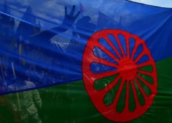 Participants of Prague's World Roma Festival Khamoro 2015 hold a flag of the Romani people in Prague, Czech Republic, on May 29, 2015. Roma artists from across the world participate in the festival, which features concerts, exhibitions and seminars. AFP PHOTO / MICHAL CIZEKMICHAL CIZEK/AFP/Getty Images ORG XMIT: 342