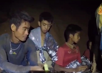 epa06862806 A video grab handout made available by Thai Royal Navy shows some of the members of a trapped soccer team in a section of Tham Luang cave in Khun Nam Nang Non Forest Park, Chiang Rai province, Thailand, 04 July 2018. Chiang Rai provincial Governor Narongsak Osatanakorn said on 02 July that all of 13 members of a youth soccer team, including their coach, had been found alive in a cave after they went missing over a week prior. Rescuers have delivered supplies and food into the cave to sustain the team while there extraction is planned.  EPA-EFE/ROYAL THAI NAVY / HANDOUT HANDOUT EDITORIAL USE ONLY/ NO SALES HANDOUT EDITORIAL USE ONLY/NO SALES