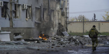 epa10264093 A Russian serviceman walks at the site of a car explosion near the 'ZaTV' broadcaster building in Melitopol, Zaporizhzhia region, southeastern Ukraine, 25 October 2022. At least five people were injured after a car exploded near the building of the 'ZaTV' television company in the city of Melitopol, said journalist Alexander Malkevich, a member of the Russian Public Chamber who oversees the work of the television company.  EPA-EFE/STRINGER