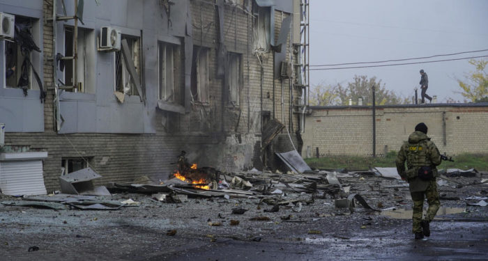 epa10264093 A Russian serviceman walks at the site of a car explosion near the 'ZaTV' broadcaster building in Melitopol, Zaporizhzhia region, southeastern Ukraine, 25 October 2022. At least five people were injured after a car exploded near the building of the 'ZaTV' television company in the city of Melitopol, said journalist Alexander Malkevich, a member of the Russian Public Chamber who oversees the work of the television company.  EPA-EFE/STRINGER