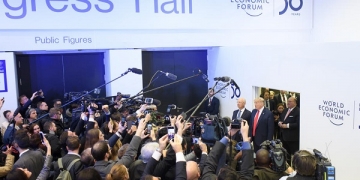 epa08146929 US President Donald J. Trump (R, red tie) speaks to the media next to German Klaus Schwab (2-R), Founder and Executive Chairman of the World Economic Forum, before addressing a plenary session during the 50th annual meeting of the World Economic Forum (WEF) in Davos, Switzerland, 21 January 2020. The meeting brings together entrepreneurs, scientists, corporate and political leaders in Davos under the topic 'Stakeholders for a Cohesive and Sustainable World' from 21 to 24 January 2020.  EPA-EFE/ALESSANDRO DELLA VALLE