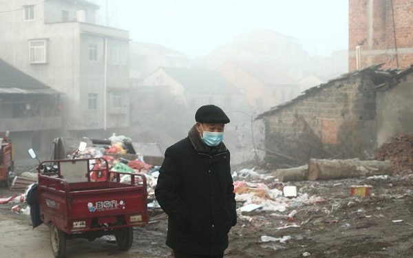 epa08177377 An old man wearing a medical mask walks in the village at sunrise in Jianli county, Hubei province, China, 28 January 2020 (issued 30 January 2020). China announced on 27 January that the Spring Festival holiday would be extended to 02 February 2020 after the coronavirus outbreak spread across the country. The virus, which originated in the Chinese city of Wuhan, has so far killed more than 160 people and infected around 6,000, mostly in China.  EPA-EFE/LIU TAO CHINA OUT