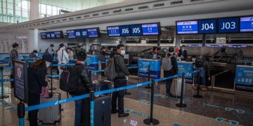 epa08349893 Passengers in protective gears wait at Wuhan Tianhe International Airport after the lockdown was lifted in Wuhan, China, 08 April 2020. Wuhan, the epicenter of the coronavirus outbreak, lifted the lockdown on 08 April 2020, allowing people to leave the city after more than two months. According to Chinese government figures, over 2,500 people have died of Covid-19 in Wuhan since the outbreak began.  EPA-EFE/ROMAN PILIPEY