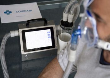 epa08356712 Cedric Pahud, Director and Owner of BCD microtechnique, tests the Covidair respiratory machine, a non-invasive ventilation (NIV) respiratory support for the COVID-19 health crisis during the state of emergency of the coronavirus disease (COVID-19) outbreak, in Preverenges, Switzerland, 09 April 2020 (issued 11 April 2020). BCD microtechnique is a SME (small and medium-sized enterprise) in the canton of Vaud with eight employees which normally develops sensors and measuring instruments for use in industry, watch-making and the medical sector. On 10 March 2020 the team of engineers started to develop and then produce non-invasive ventilation devices (respirator with mask). After 22 days, 10 machines were up and running, the manufacturing of another 160 machines is currently in progress. Clinical tests and certification are currently being conducted in hospitals.  EPA-EFE/LAURENT GILLIERON