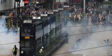 epa08440582 Police fire tear gas to disperse protesters during a rally against the implementation of a new national security law in Causeway Bay, Hong Kong, China, 24 May 2020. Beijing unveiled a resolution at the opening of its annual legislative sessions that will bypass Hong Kong's legislature to outlaw acts of secession, subversion and terrorism in Hong Kong.  EPA-EFE/JEROME FAVRE