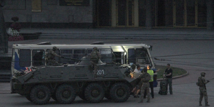 epaselect epa08559219 Policemen ride an armoured personnel carrier (APC) during the release of hostages captured in the bus in the downtown of the Western Ukrainian city of Lutsk, western Ukraine, 21 July 2020. According to local media, an armed man had taken the commuter bus' passengers and driver hostage. Shots were reported at the scene. The head of the National Police's regional department, Yuriy Kroshko, said the attacker had threatened hostages with a firearm and an explosive device. Ukraine's Deputy Interior Minister Anton Gerashchenko said the alleged hijacker had identified himself as Maksym Plokhoy. The suspect also claimed he had planted another explosive in an unspecified crowded location in Lutsk and said he would set off that bomb if his demands were not met. According to officials, Plokhoy is a convicted felon and has a history of mental disorders.  EPA-EFE/MARKIIAN LYSEIKO