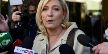 epa09716311 French far-right leader Marine Le Pen speaks to media as she takes part in an event organized by Spanish far-right party Vox at a hotel in Madrid, Spain, 29 January 2022.  EPA-EFE/VICTOR LERENA