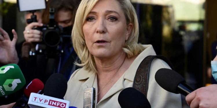 epa09716311 French far-right leader Marine Le Pen speaks to media as she takes part in an event organized by Spanish far-right party Vox at a hotel in Madrid, Spain, 29 January 2022.  EPA-EFE/VICTOR LERENA